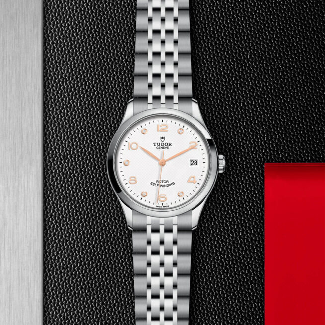 A M91450-0013 watch with a white dial on a black background.