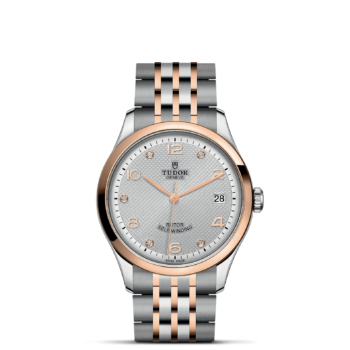A watch with a M91451-0002 rose gold and silver bracelet.