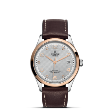 A M91451-0006 with brown leather straps and white dial.