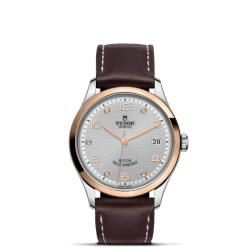 A M91451-0006 with brown leather straps and white dial.