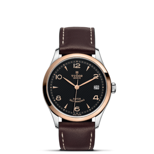 A watch with brown leather straps on a black background M91451-0007.