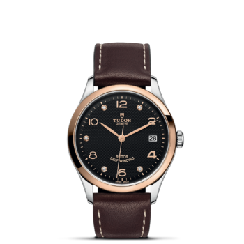 A M91451-0008 with brown leather straps and a black dial.