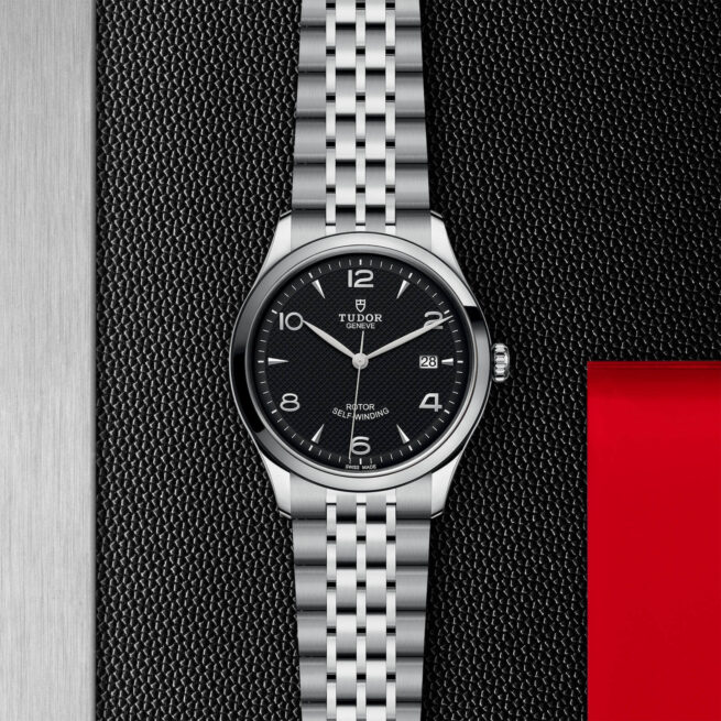 A M91550-0002 watch on a red background.