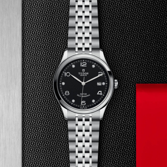 A M91550-0004 watch on a red background.