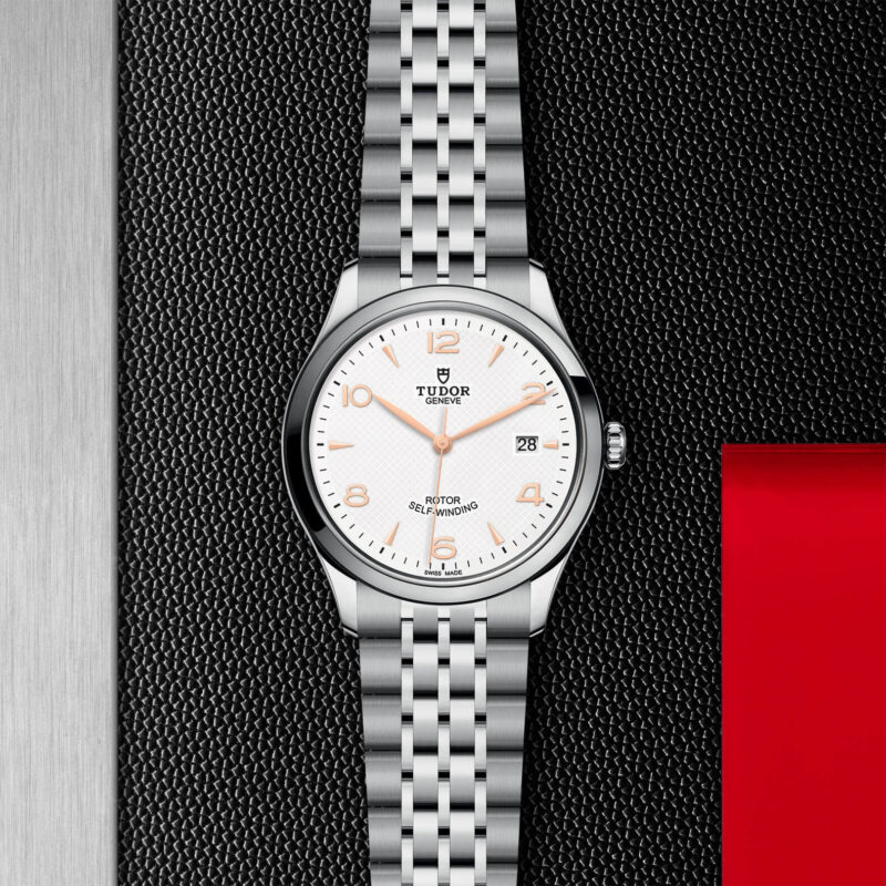 A M91550-0011 watch with a white dial on a black background.