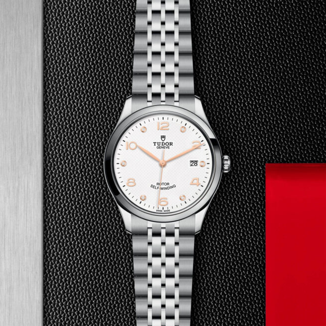 A M91550-0013 watch on a black and red background.