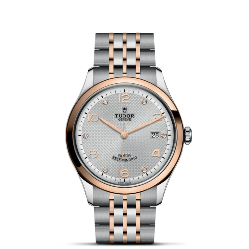 A Tissot M91551-0001 with a silver and rose gold bracelet.