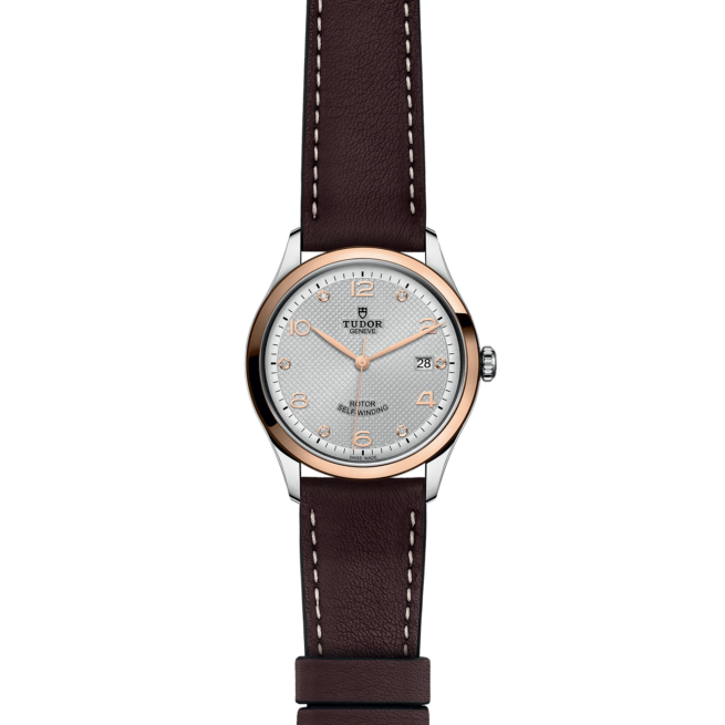 A ladies watch with brown leather strap.