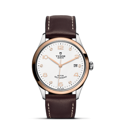 The tissot classic watch with brown leather strap.