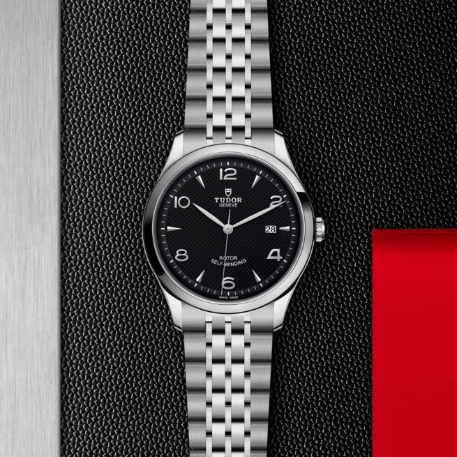 A M91650-0002 watch on a red background.