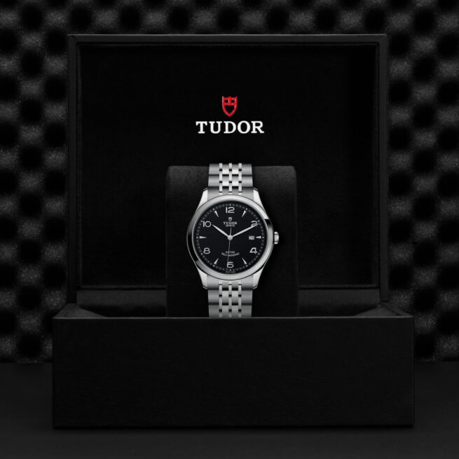 A M91650-0002 tudor watch in a black box.