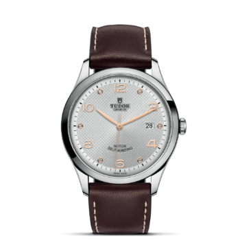 A M91650-0007 with a brown leather strap and white dial.