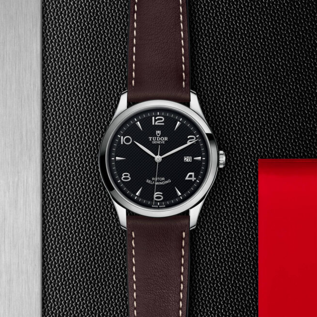 A M91650-0008 with a red strap.