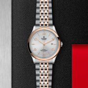 A M91651-0001 watch on a black background.