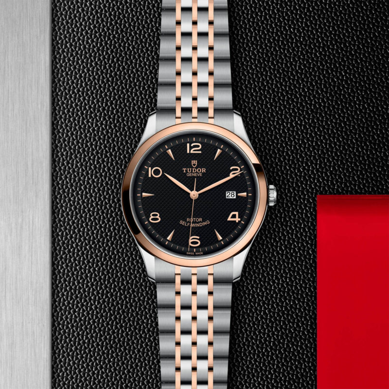 A M91651-0003 watch on a black leather background.