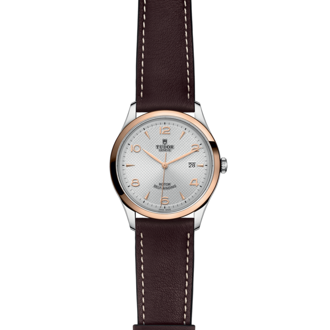 A M91651-0005 with a brown leather strap and white dial.