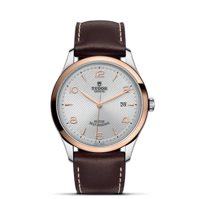 A M91651-0005 with brown leather straps on a black background.