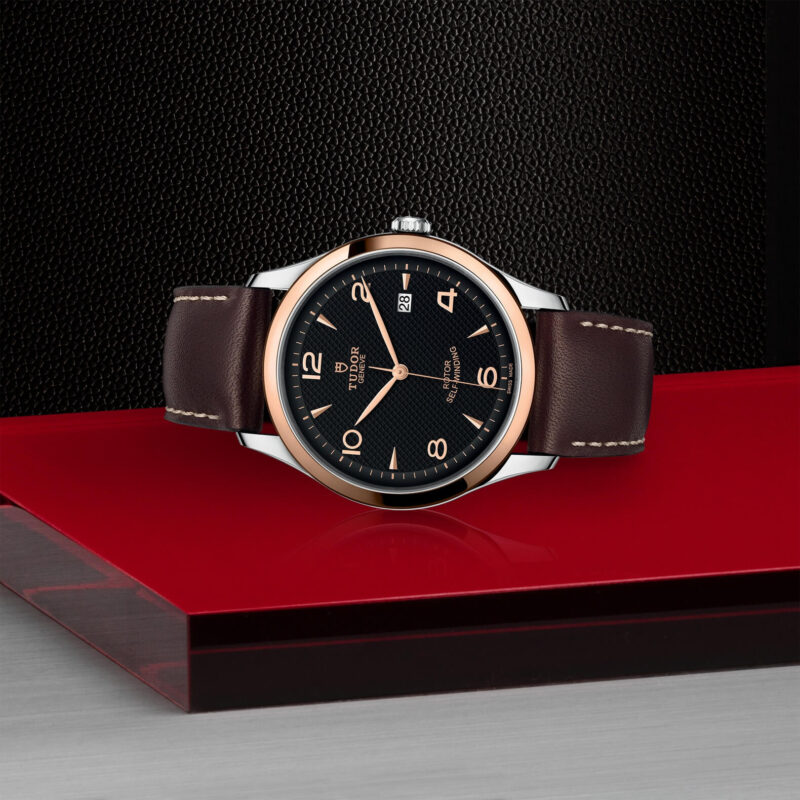 A M91651-0007 watch on a red table.