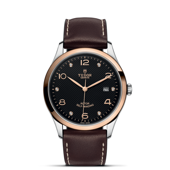 A M91651-0008 with brown leather straps on a black background.