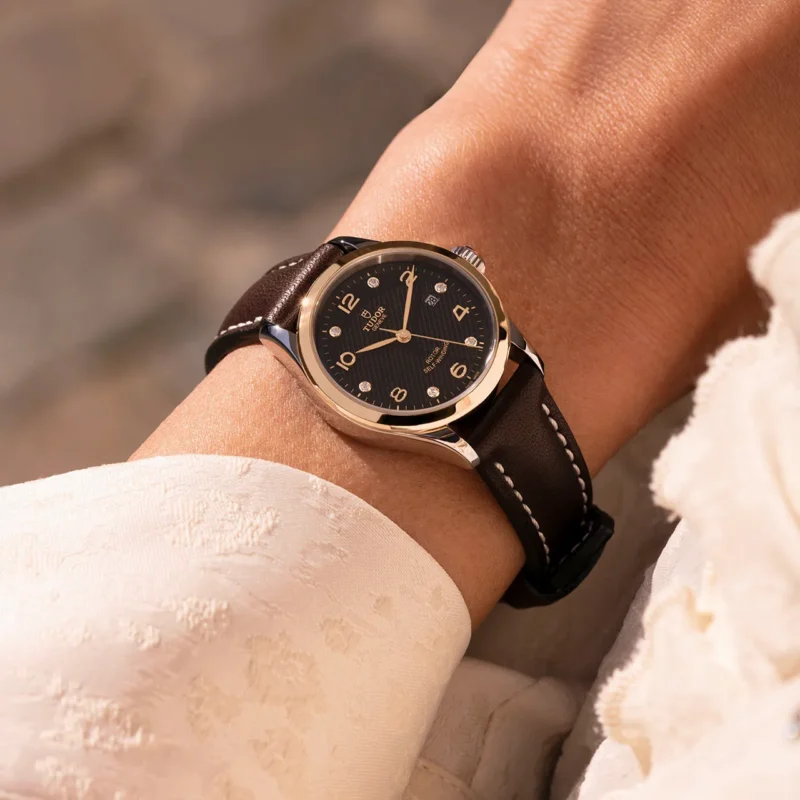 A woman's wrist with a M91350-0008 watch on it.