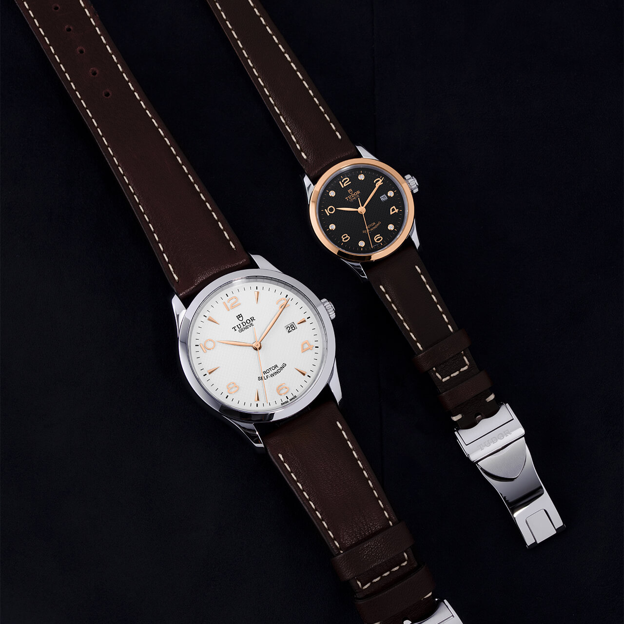 Two M91651-0012 with brown straps on a black background.