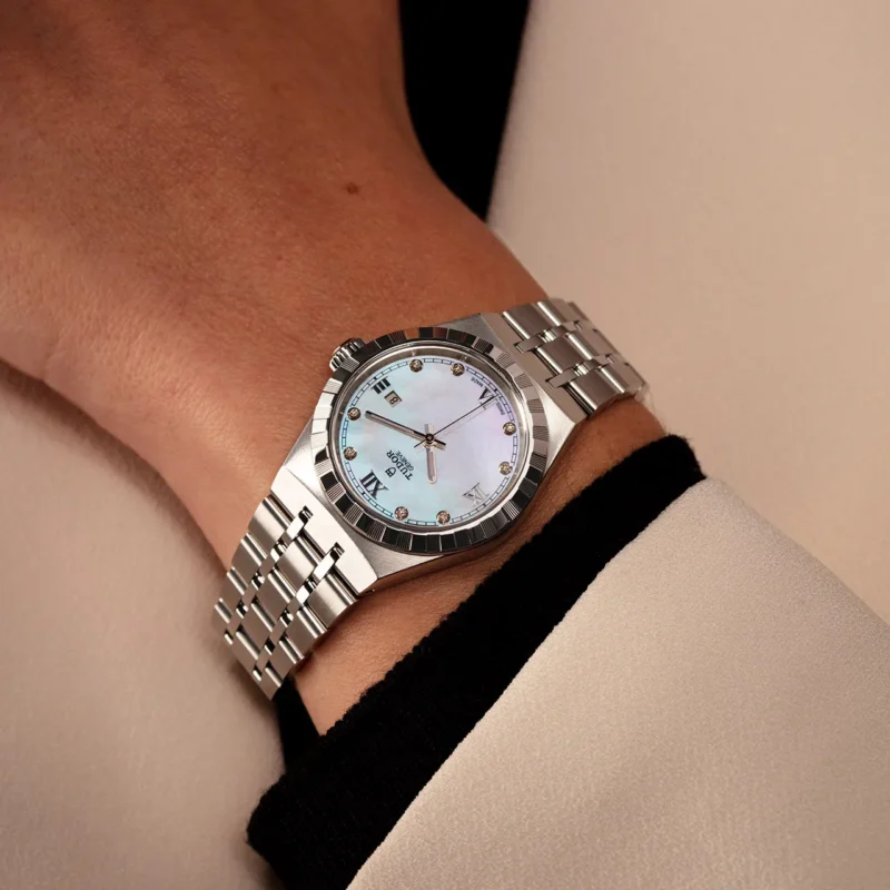 A woman's wrist with a M28400-0005 watch on it.