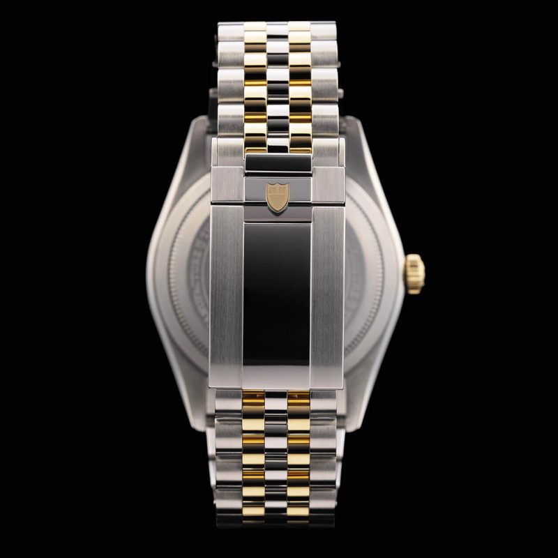 A rolex watch with a gold and silver dial.