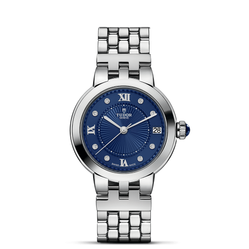 Silver wristwatch with a blue face, Roman numerals at the 12, 3, 6, and 9 positions, diamond markers, and a date display at the 3 o'clock position.