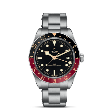 A M7939G1A0NRU-0001 with a black dial, red and blue bezel, and date display at 3 o'clock. The watch features luminous hour markers and a stainless steel bracelet.