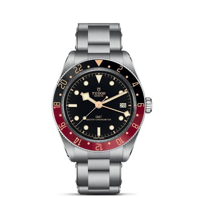 A M7939G1A0NRU-0001 with a black dial, red and blue bezel, and date display at 3 o'clock. The watch features luminous hour markers and a stainless steel bracelet.