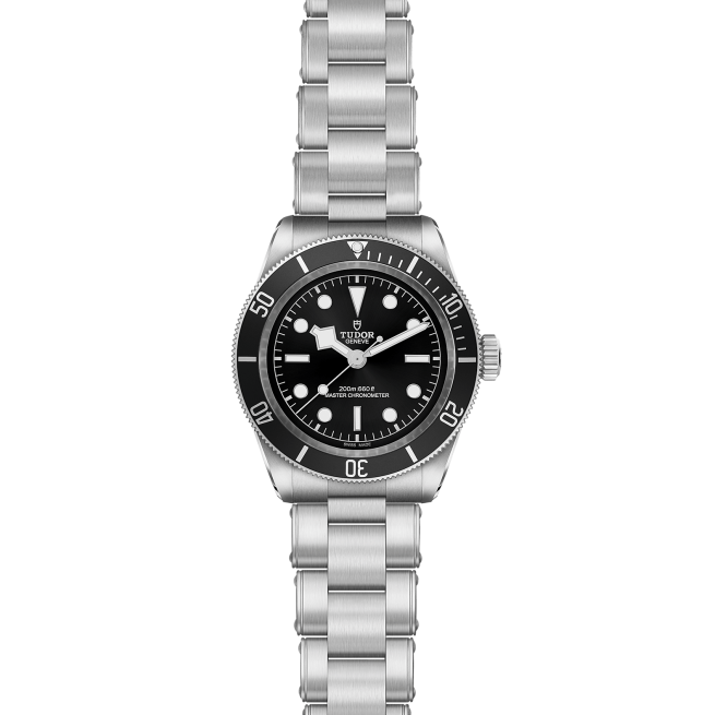 A silver stainless steel wristwatch with a black dial and bezel, featuring luminescent markers and hands, and a metal link strap.