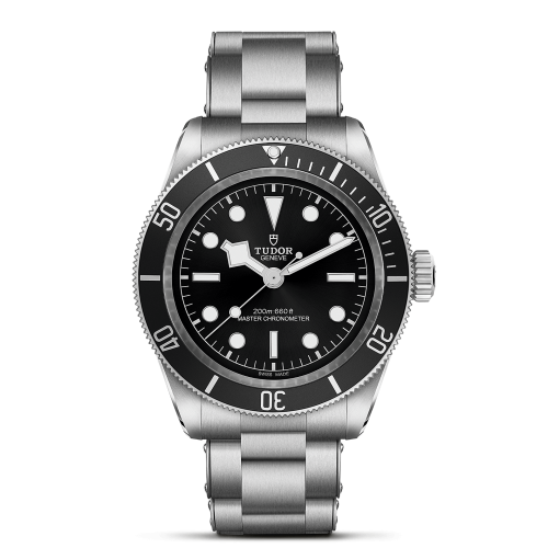 Stainless steel Tudor wristwatch with a black dial and bezel, featuring luminous hour markers, a date window, and a metal bracelet.