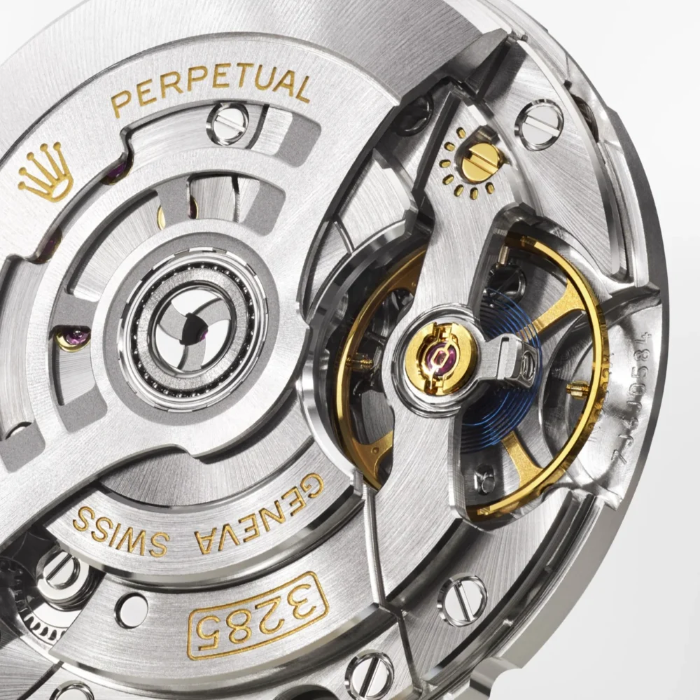 Close-up view of a luxury watch movement showcasing intricate gears and inscribed details like "PERPETUAL" and "GENEVA SWISS.