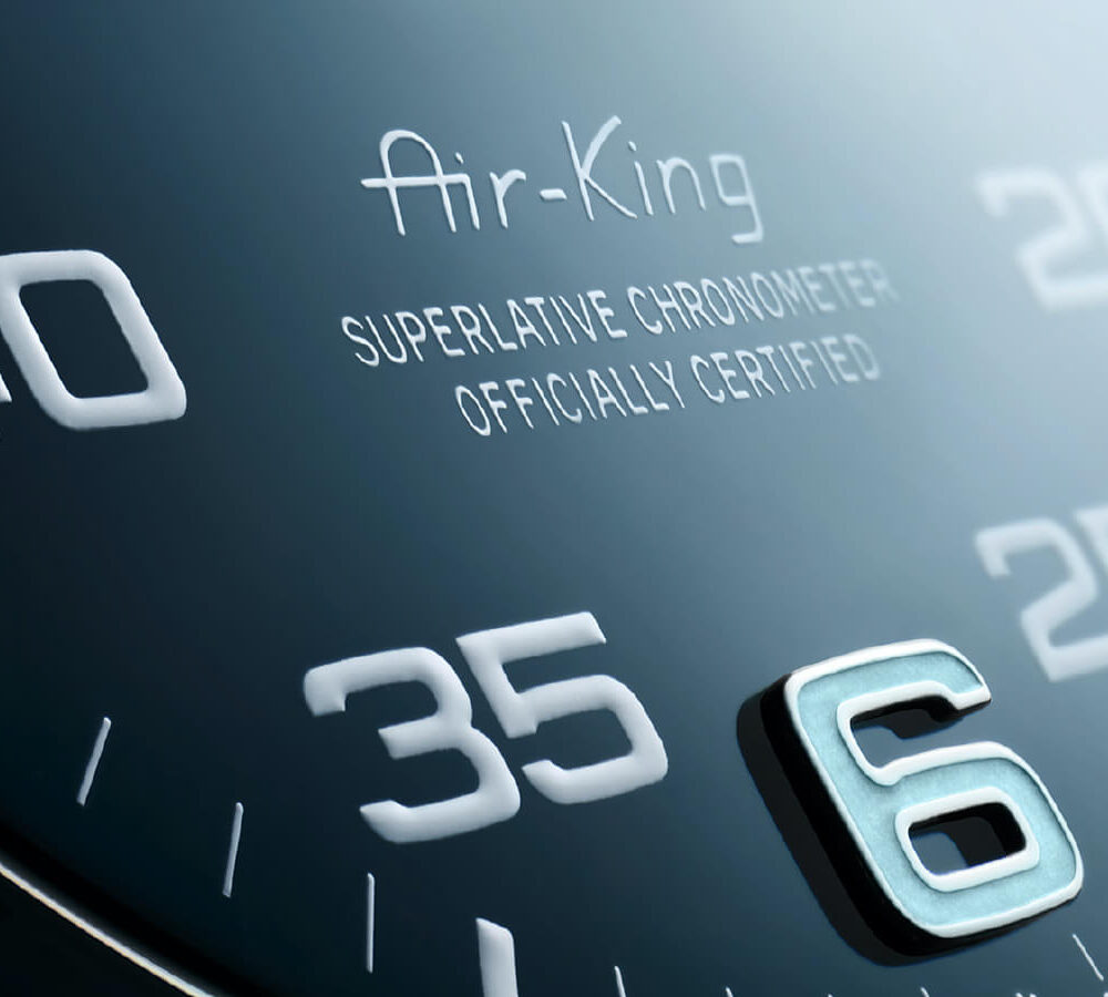 Close-up view of a Rolex Air-King watch dial featuring the numbers 35, 40, and 6, with "Superlative Chronometer Officially Certified" text.