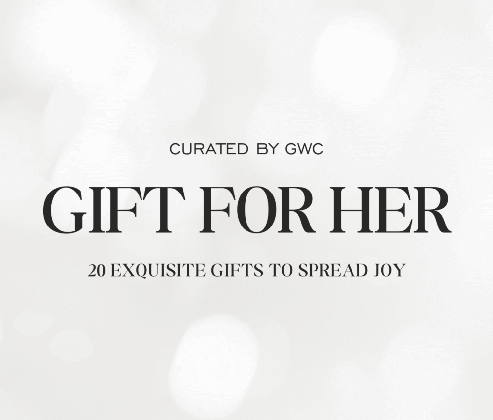 Elegant "Gift for Her" banner featuring a wristwatch, tan jacket, black handbag, pens, and perfumes.