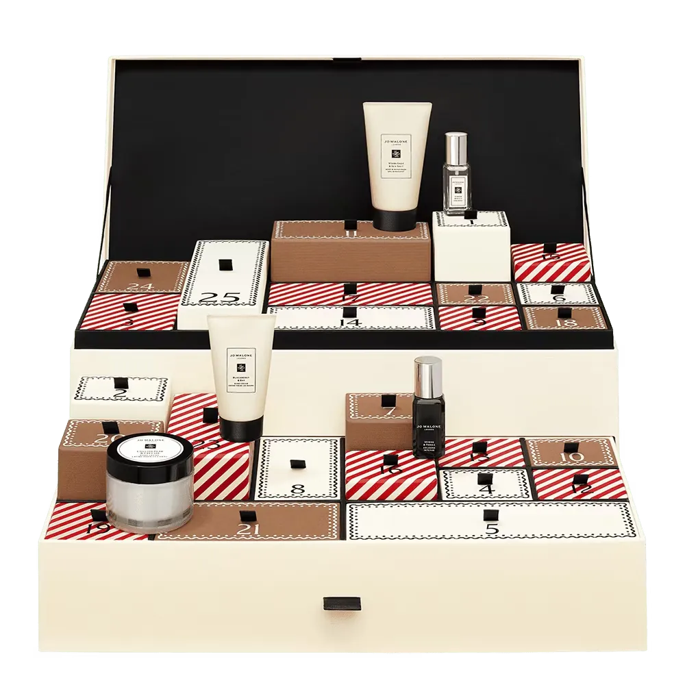 An elegant advent calendar with beauty products, including creams, perfumes, and makeup items, arranged in numbered compartments.