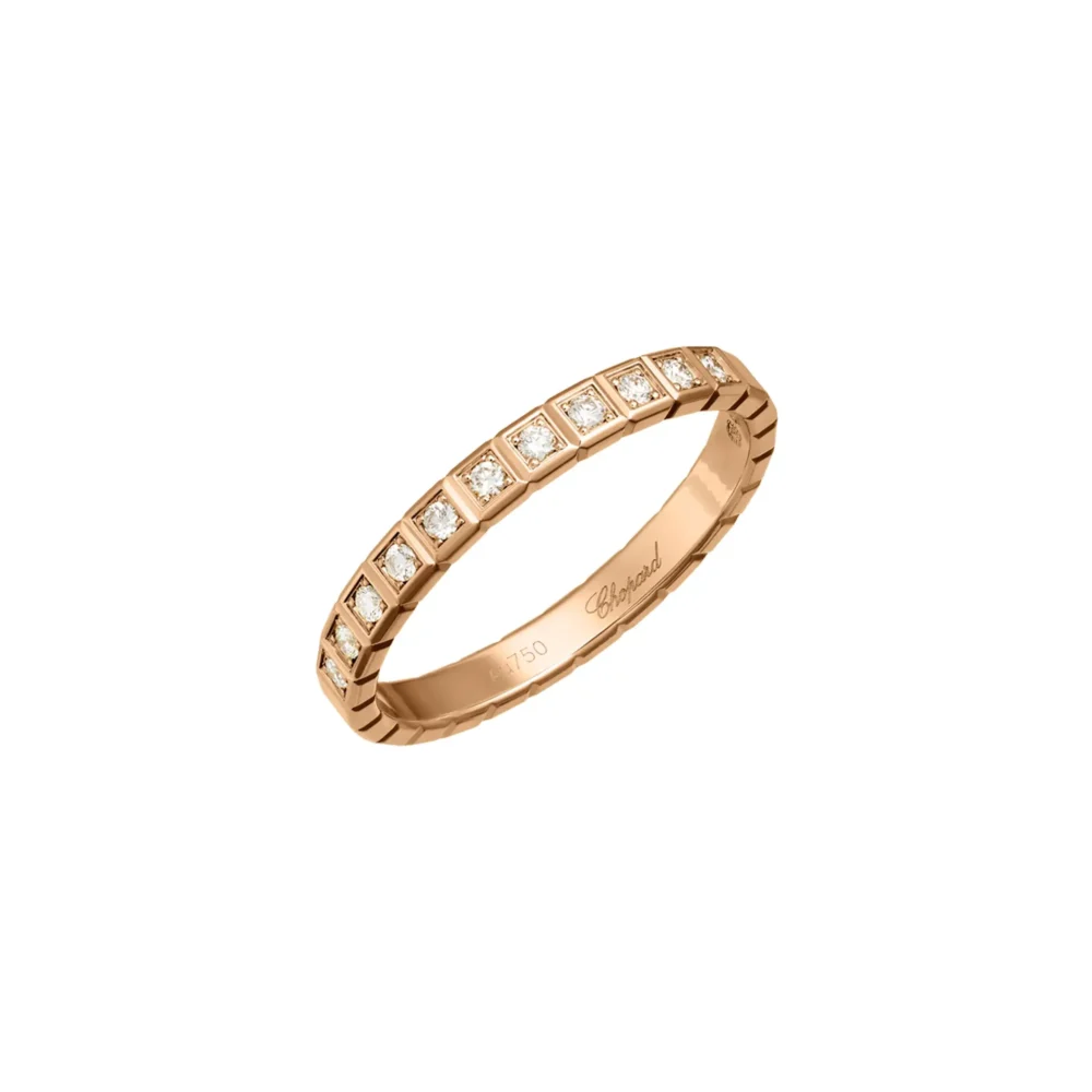 Rose gold ring with square-cut diamonds set in a channel setting, engraved with the Chopard logo.